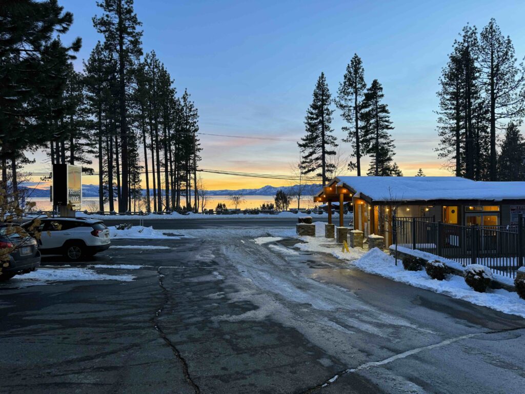 firelite lodge with snow on the roof and lake tahoe in the distance