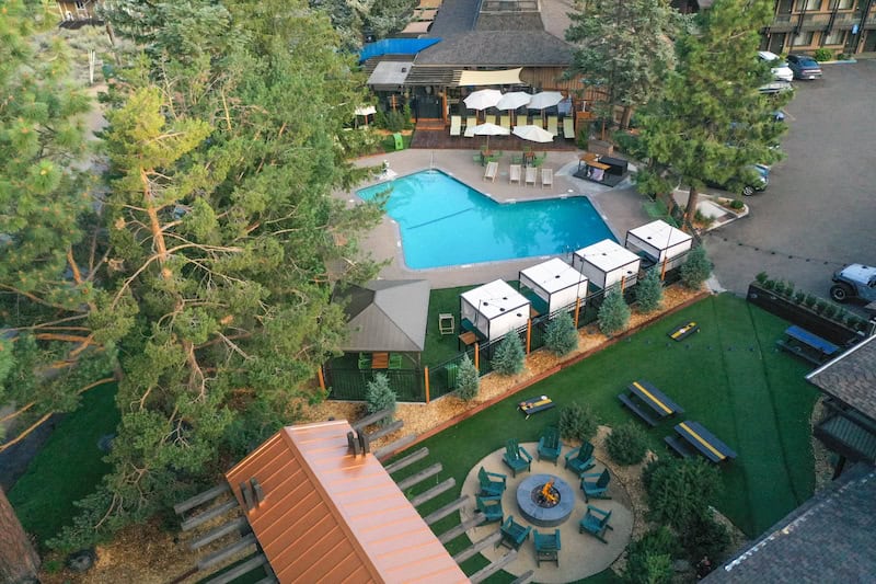 Station House Inn aerial view of pool, cabanas, and firepits